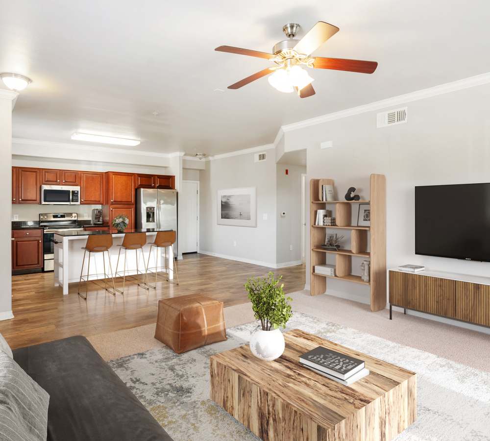Upgraded kitchen and living room with hardwood style flooring at Wolf Ranch Condominium Rentals in Sacramento, California