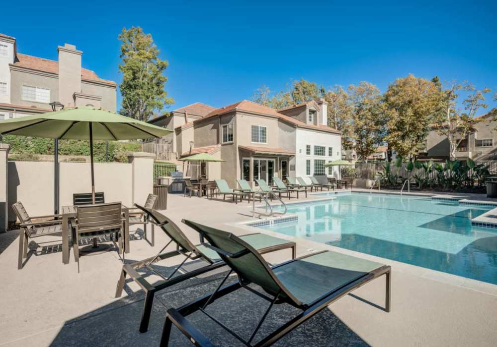 Sparkling pool with lounge chairs at The Bluffs in Rancho Cucamonga, California