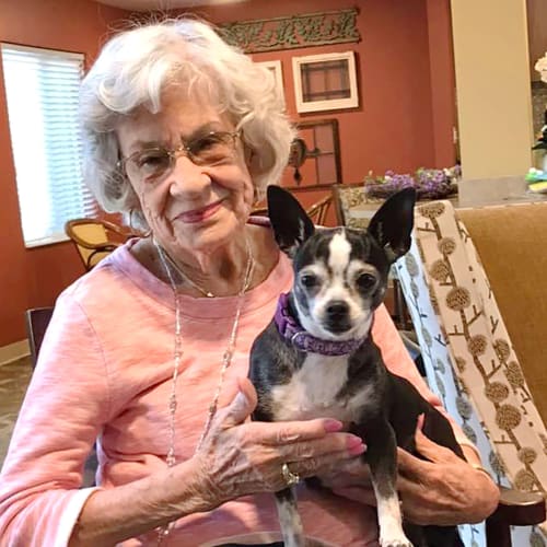 Resident coloring with crayons at The Oxford Grand Assisted Living & Memory Care in McKinney, Texas