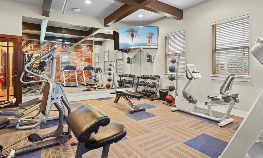 Fitness center at Cottages at Tallgrass Point Apartments in Owasso, Oklahoma