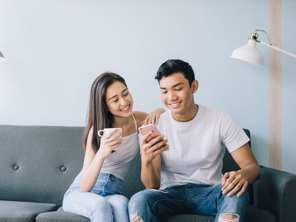 Residents filling out a form on our website using their mobile device at Panorama Apartments in Seattle, Washington