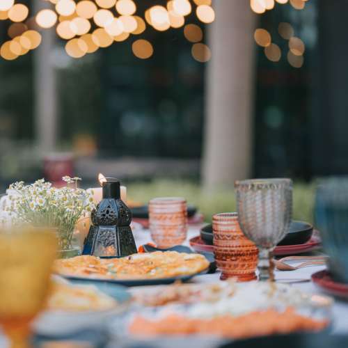 Table set with colorful glasses and food at Richwood Greene Senior Living in Richwood, Ohio