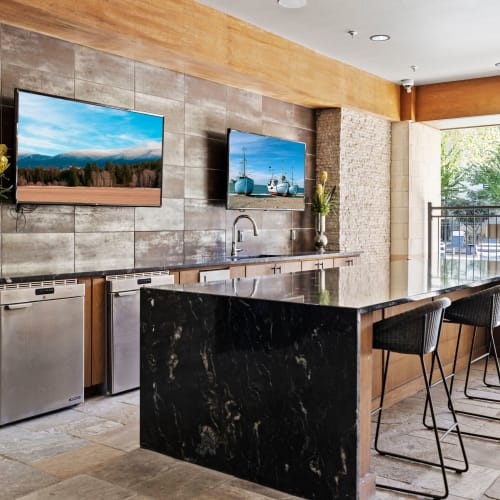 Sleek kitchen with island at Olympus at Memorial in Houston, Texas