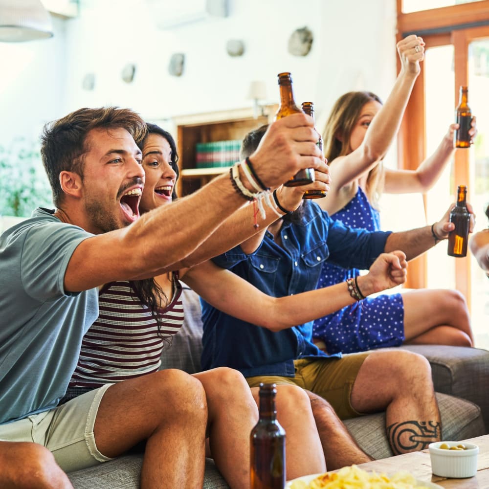 A group of residents watching a sporting event together at The Legends on the Park in Eureka, Missouri