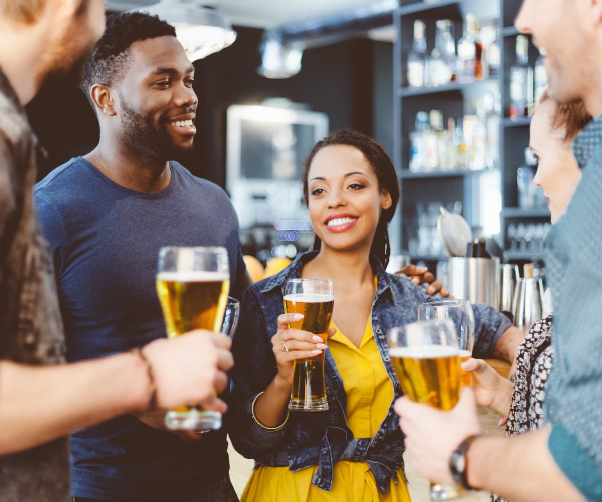 Friends enjoying a drink at Mission Point Apartments in Moore, Oklahoma