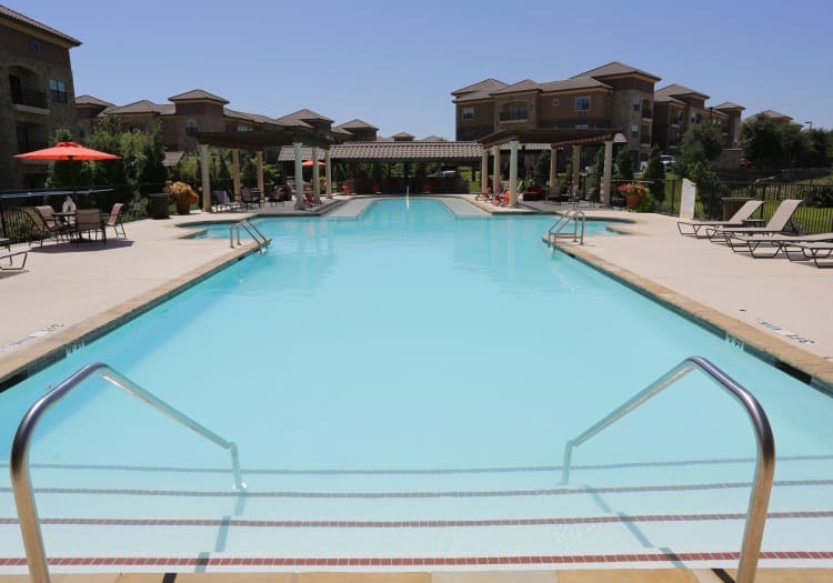 Gorgeous swimming pool area on a beautiful day at Evolv in Mansfield, Texas