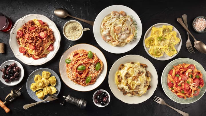 Various Italian food dishes spread across a table