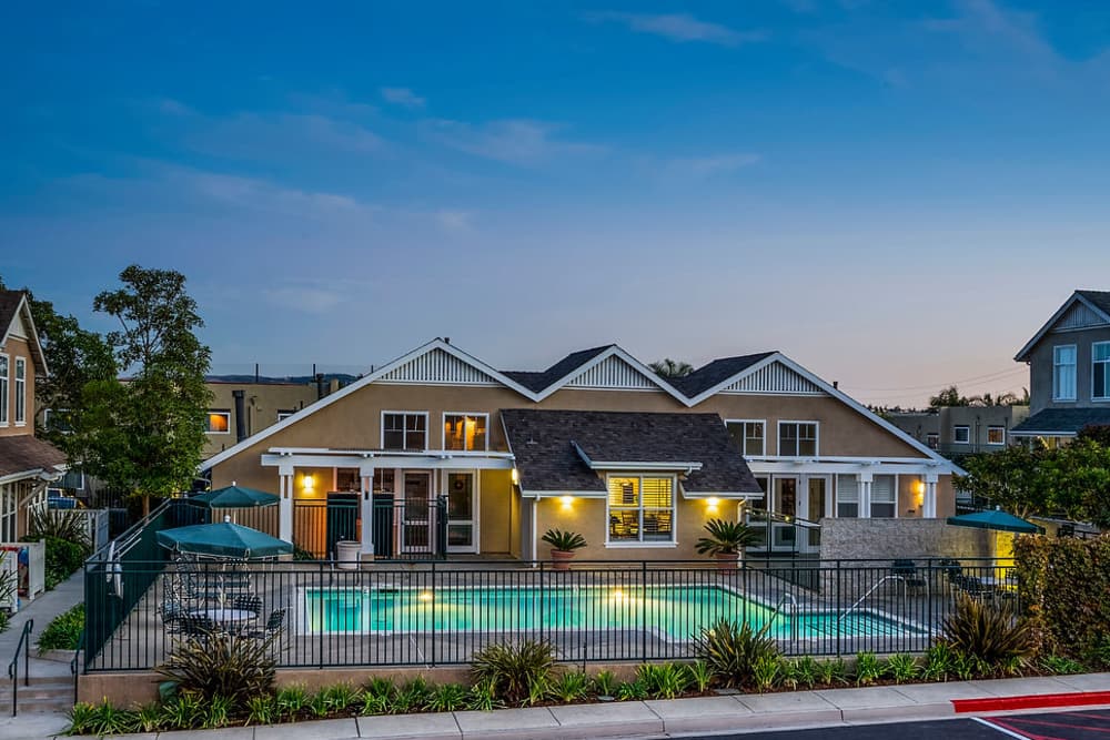 Clubhouse and pool at night at Village Heights in Newport Beach, California