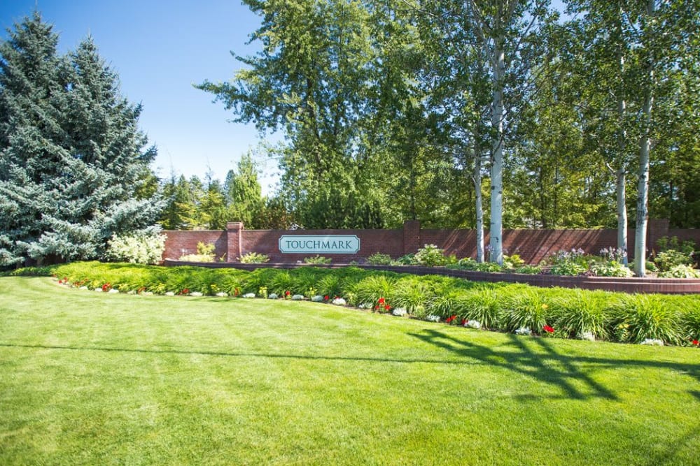 Branding and signage behind bushes at Touchmark on South Hill in Spokane, Washington