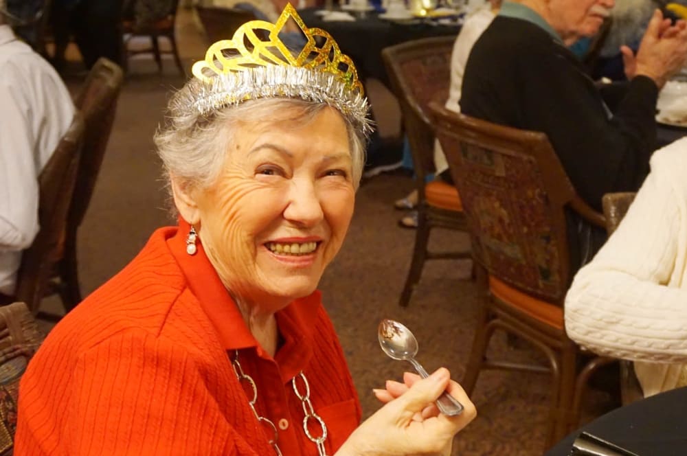 Resident enjoying a meal at special event at Winding Commons Senior Living in Carmichael, California