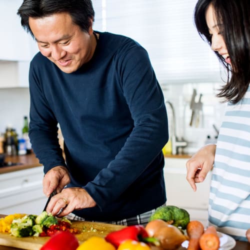 Residents chopping vegetables at Eucalyptus Ridge in Lakeside, California