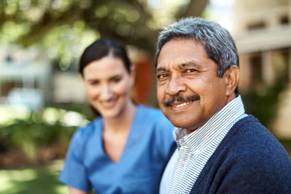 Resident and staff member at Seasons Memory Care at Rolling Hills in Torrance, California.