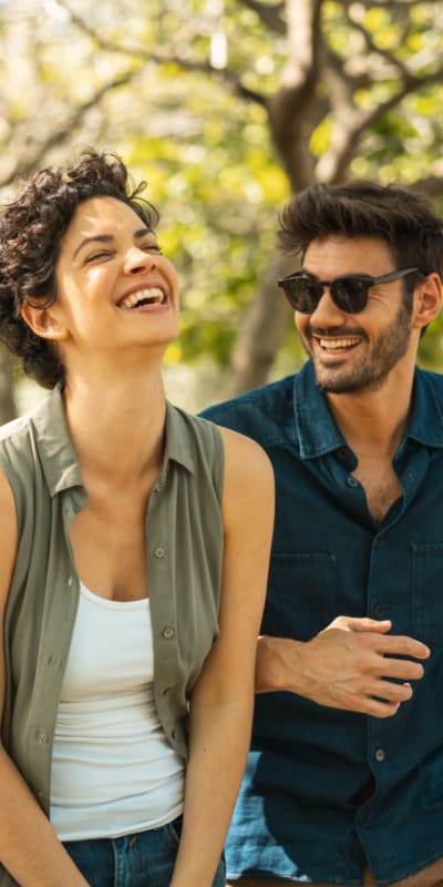 Couple enjoying the day at a park near Rivers Pointe Apartments in Liverpool, New York