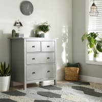 A furnished apartment bedroom with a dresser and potted plant at The Lively Indigo Run in Ladson, South Carolina