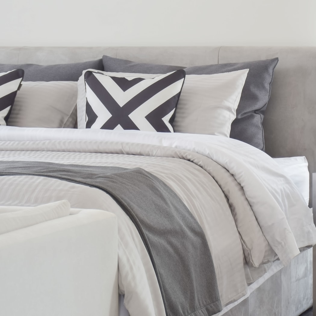 Modern model bedroom at Oak Pointe Apartments in Fremont, California
