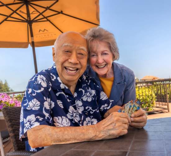 Resident couple poses for a picture at Merrill Gardens at Auburn in Auburn, Washington. 