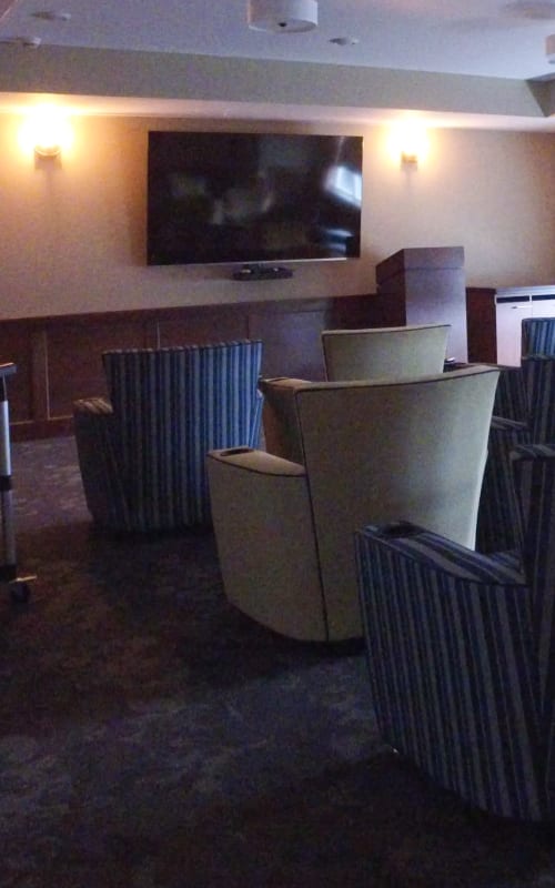 Resident movie theater room with lots of seating and large flat-screen television at The Pillars of Mankato in Mankato, Minnesota
