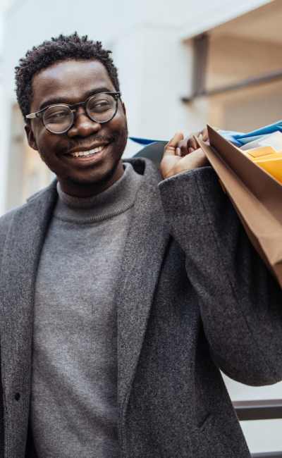 Resident buying clothes in a local shopping mall near Greece Commons Apartments in Rochester, New York