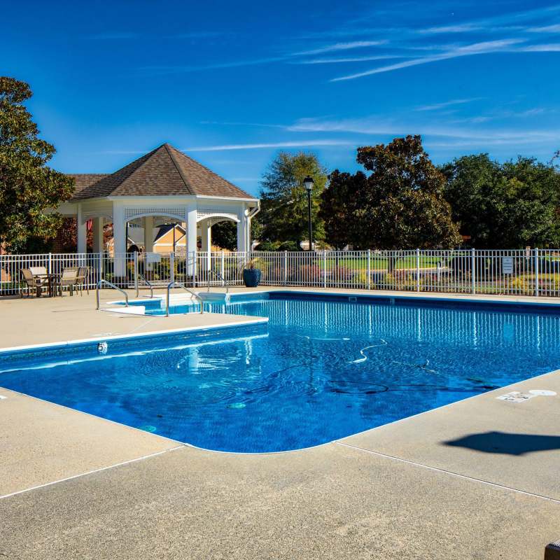 Resort-style pool with in-pool lounge chairs at Magnolia Chase, Virginia Beach, Virginia