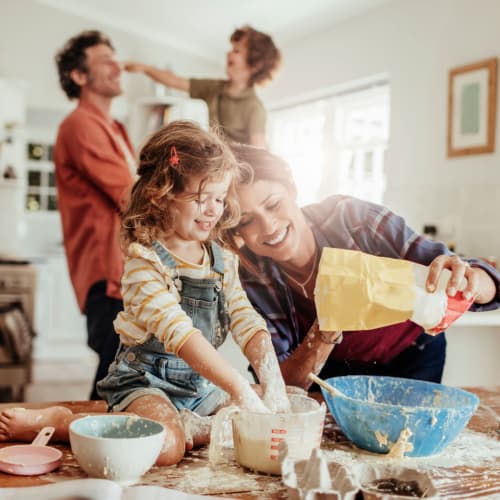 A family cooking in the kitchen Heroes Manor in Camp Lejeune, North Carolina