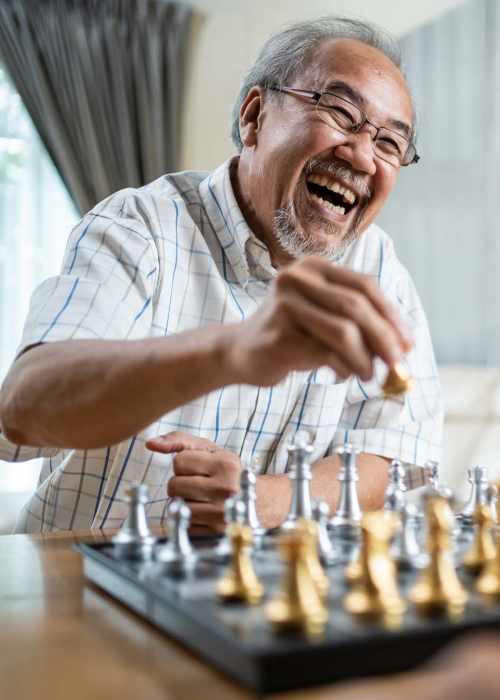 Grandfather playing chess at Grand Villa of Ocala in Ocala, Florida