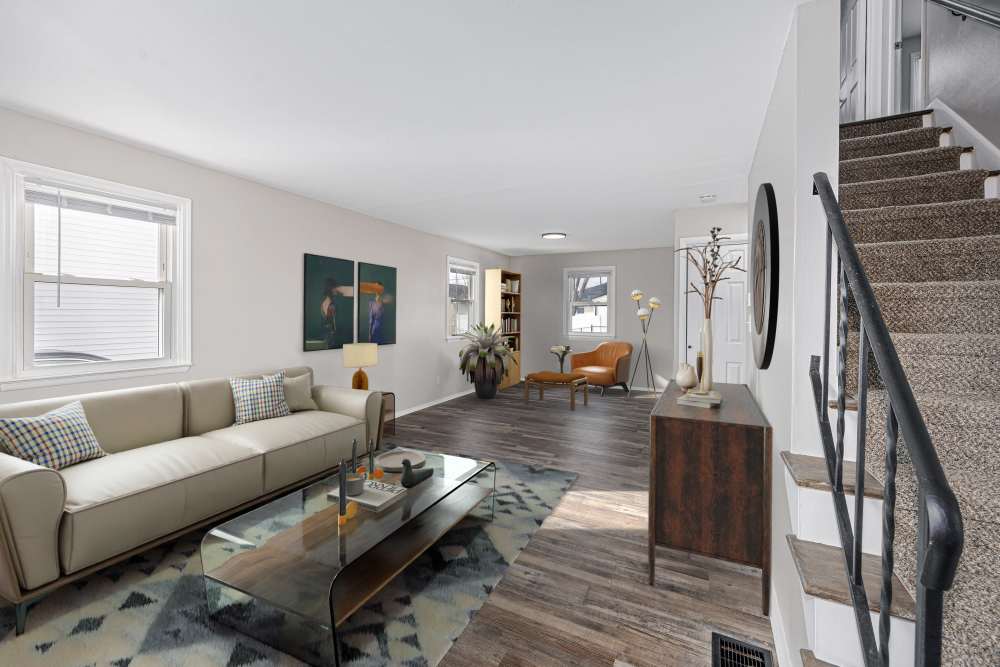 Living area with staircase at Eden Green Townhomes in Columbus, Ohio