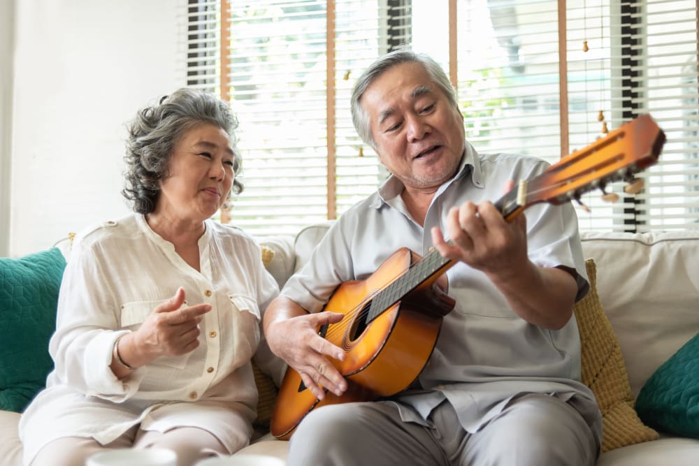 A resident playing guitar at Alura By Inspired Living in Rockledge, Florida. 