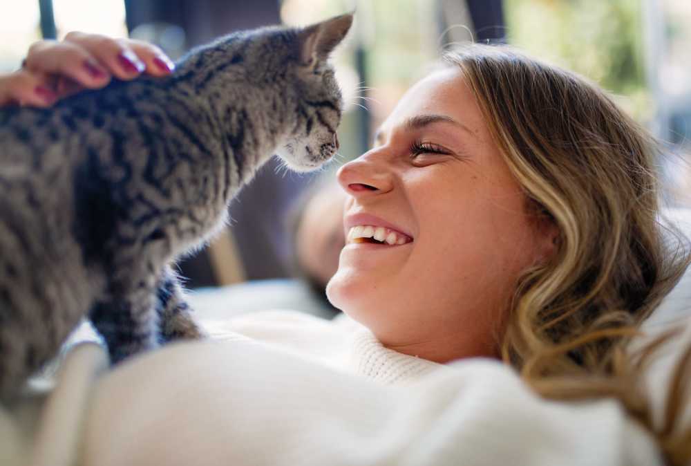 Smiling resident and her cat at  South Mountain Apartment Homes in Allentown, Pennsylvania