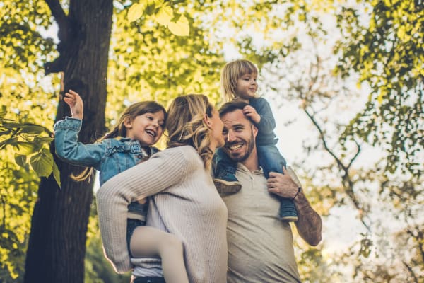 Happy family at a park near Heritage Meadow Apartments in Eugene, Oregon