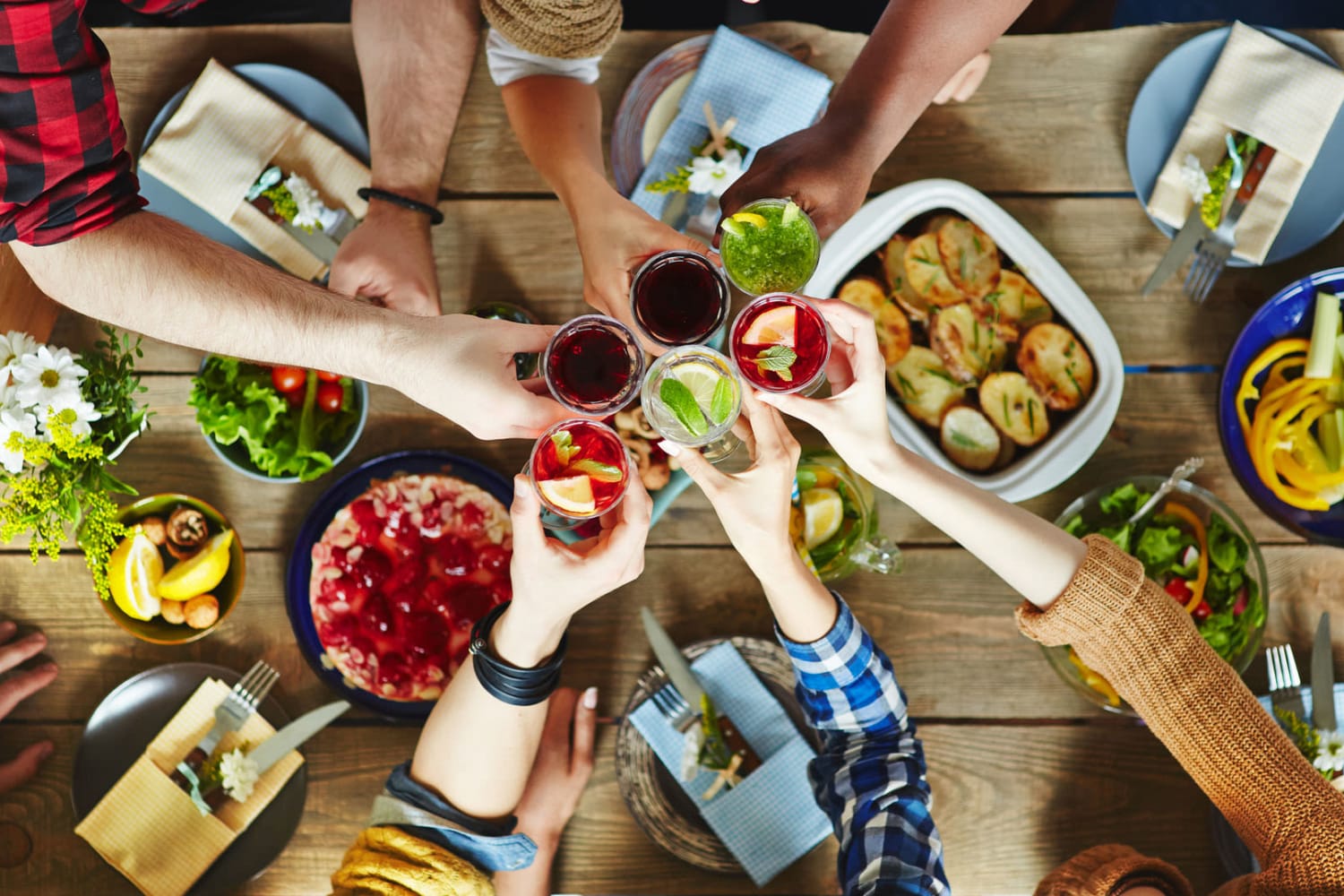 Friends out on the town enjoying a tasty dinner with drinks near Parkway Apartments in Williamsburg, Virginia