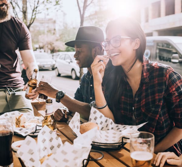 Resident and his friends out enjoying a beautiful lunch on the town in Monmouth, Oregon near Southtown Apartments
