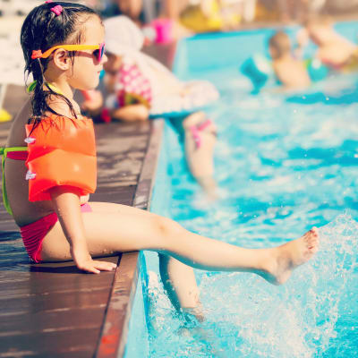 A kid in a swimming pool near Lovell Cove in Patuxent River, Maryland