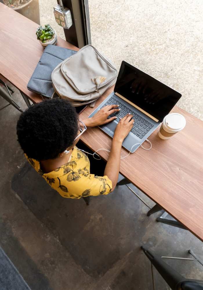 Person typing on computer at The Landing at Fayetteville in Fayetteville, Arkansas