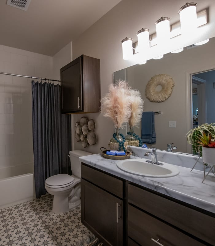 Bathroom with tile flooring at Redbud Ranch Apartments in Broken Arrow, Oklahoma