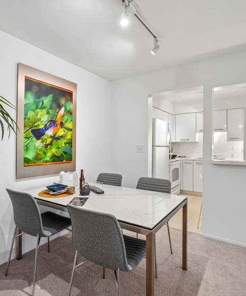 Dining room table set for entertaining in a model apartment home at Saddle Creek Apartments in Novi, Michigan