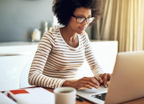 Resident on her computer at Barclay Apartments