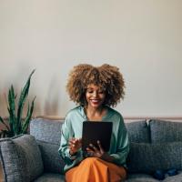 Large bay windows in a model home's living space at Green|House Short North in Columbus, Ohio