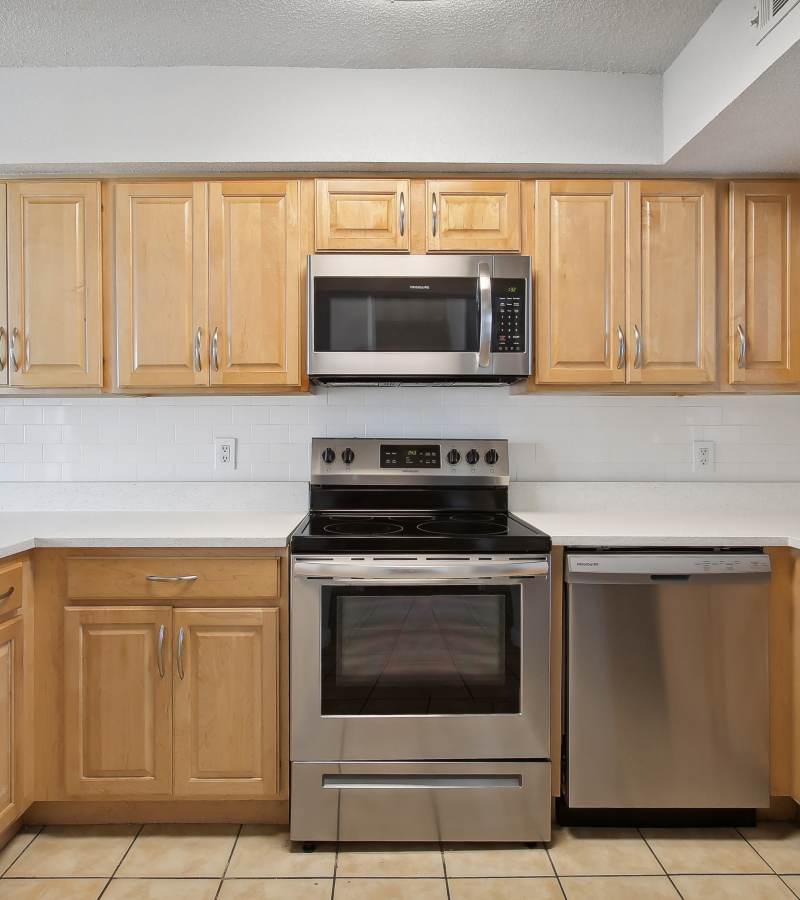 Kitchen with cabinets at The Canopy Apartment Villas in Orlando, Florida