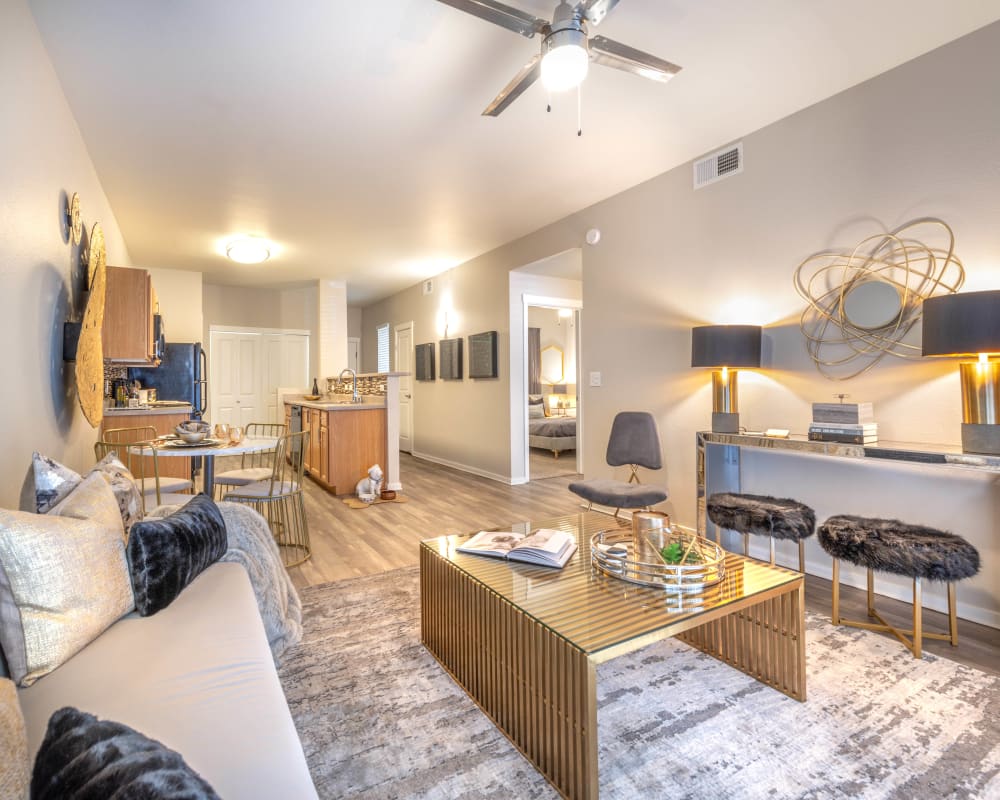 Large open-concept living area with art deco furnishings in a model home at Olympus Solaire in Albuquerque, New Mexico