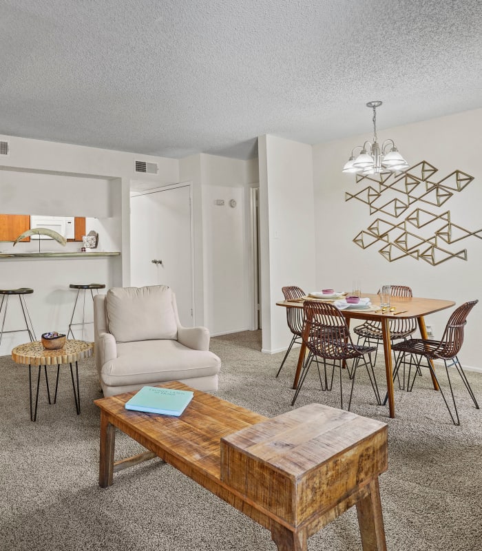 Dining area and living room at The Chimneys Apartments in El Paso, Texas
