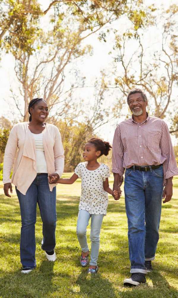 Resident family enjoying in a park near The Abbey at Briargrove Park in Houston, Texas