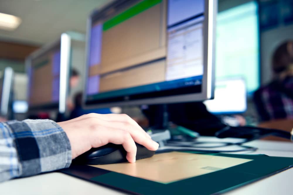 Resident working in his desktop at Casa Grande Villas in Dallas, Texas