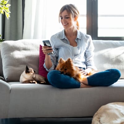 a resident hanging out with her pets at Coral Sea Cove in Port Hueneme, California