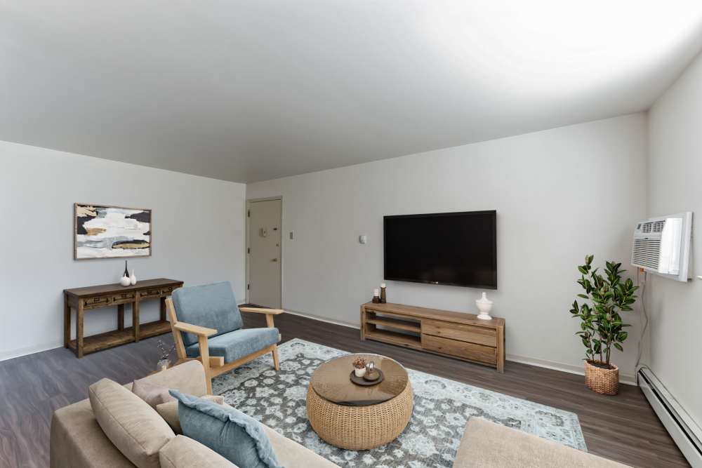 living room with vinyl plank floors and white walls