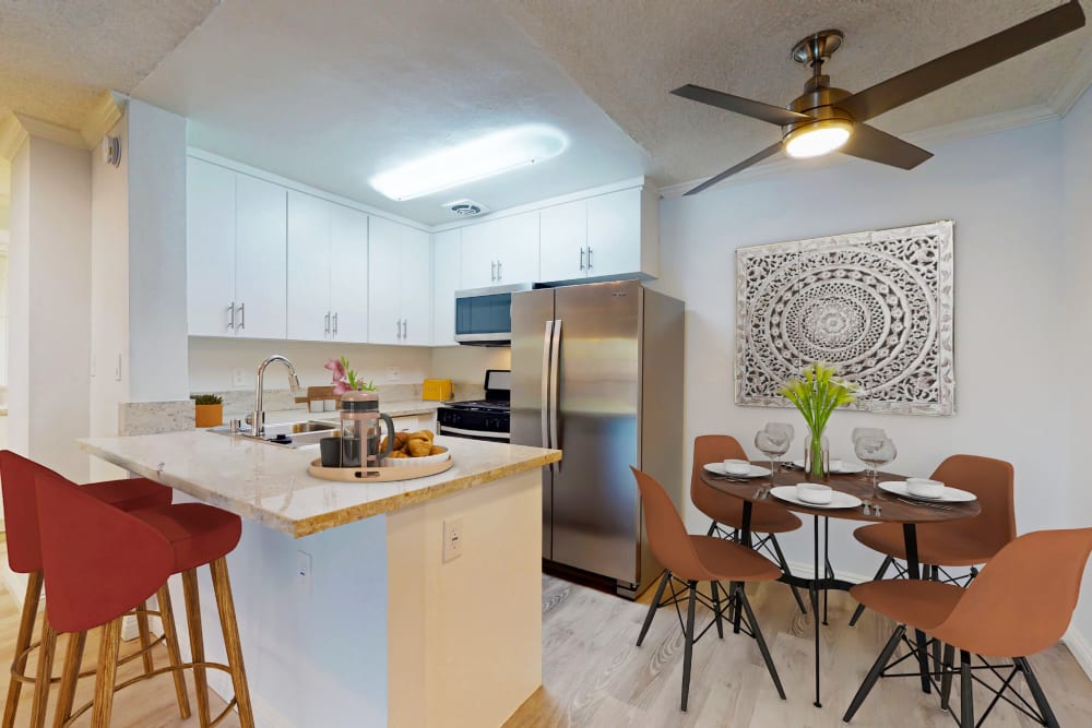 Kitchen with island in a studio apartment at Casa Granada in Los Angeles, California