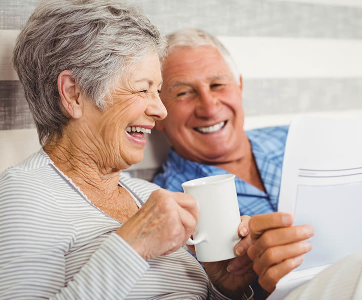 Senior laughing with caregiver at The Wellington in Salt Lake City, Utah
