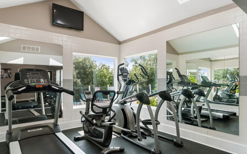 Well-equipped fitness center with cardio equipment at The Greens at Westgate Apartment Homes in York, Pennsylvania