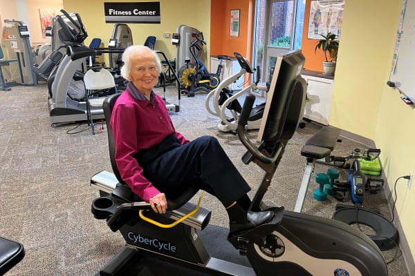 Resident on a stationary bike at The Columbia Presbyterian Community in Lexington, South Carolina