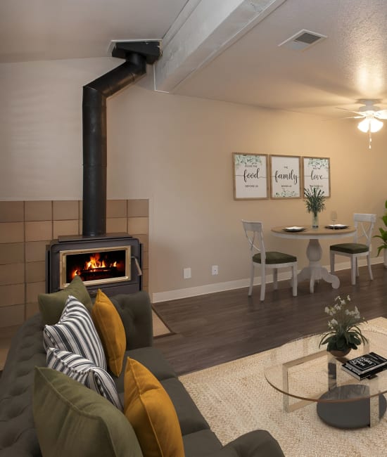 Living room area with fireplace at Auburn Townhomes in Auburn, California