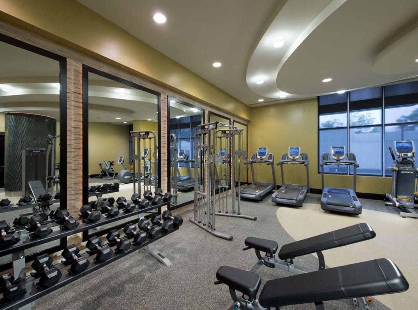 A fitness center with individual workout stations at Solaire 1150 Ripley in Silver Spring, Maryland